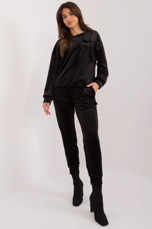 Ensemble velours noir haut col rond nœud pantalon taille élastique coupe fuselée poches dentelle décontractée style sophistiqué femme