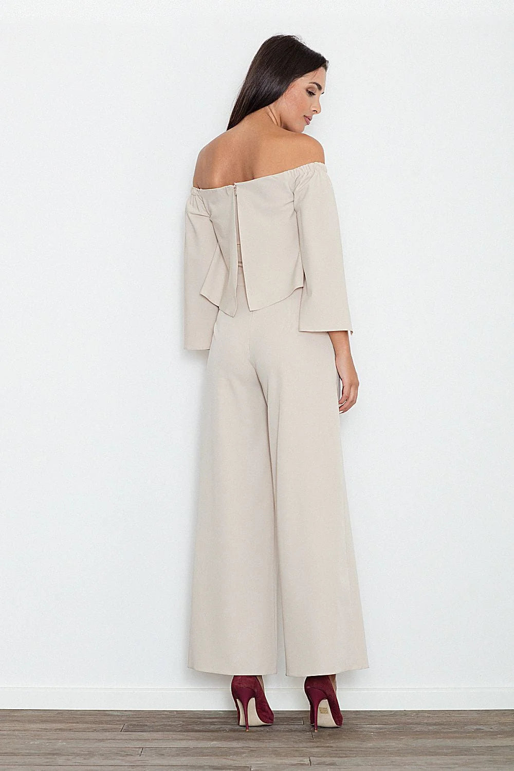 combinaison Figl pantalon noire épaules dénudées manches longues fendues haute palazzo jambes larges fluide structuré élégante allongeante soirée cocktail chic