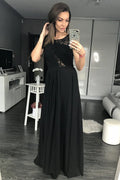 Robe longue noire dentelle élégante sophistiquée soirée chic transparence féminine silhouette raffinée mode moderne