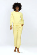 ensemble loungewear femme sweatshirt col rond manches longues molleton doux jaune pastel coupe relaxed pantalon jogging taille élastique cordon poches