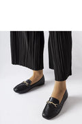 Mocassins femme élégance et confort cuir noir bijoux métal doré silhouette classique bout arrondi semelle plate occasion多种 noir