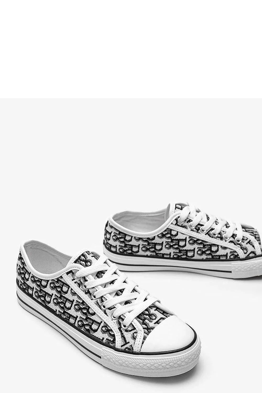 Baskets pour femme modernes design épuré motif graphique blanc noir lacets ajustables tige basse semelle caoutchouc respirante confortable style casual urbain été automne hiver
