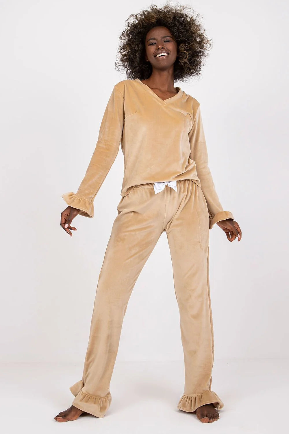 Pyjama set for women in soft beige velour, elegant and comfortable, with ruffled sleeves and waist bow, perfect for lounging at home