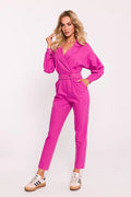 Combinaison féminine élégante couleur fuchsia design moderne décolleté en V profond manches longues volumineuses ceinture ajustable