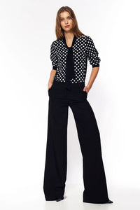 pantalon palazzo noir taille haute jambe extra large poches latérales tissu fluide viscose polyester élasthanne confortable silhouette allongeante bureau soirée