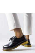 Chaussures basses cuir noir design moderne bottines femmes style classique tige basse lacets noirs semelle translucide confort polyvalence mode élégance