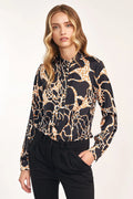 Chemise satinée imprimée léopard fluide élégante col lavallière manches longues femmes modernes chic tendance