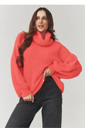 pull femme oversize col roulé maille duveteuse corail vif coupe ample manches bouffantes poignets côtelés large longueur hanche cocooning moelleuse