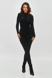 combinaison noire ajustée manches longues maille stretch col montant fronces sculptantes moulante cheville brillante lisse confortable sophistiquée élégante