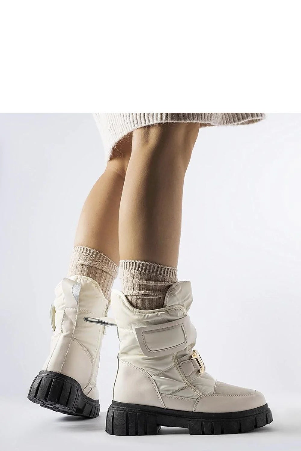 Bottes de neige Solea pour femmes style moderne élégant couleur beige cassé matériau synthétique détails dorés confort protection froid hiver