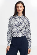 Chemisier féminin élégant motif coquillages blanc et noir coupe classique manches longues boutons discrets tissu fluide