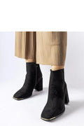 bottines suédine noires talons bloc hauts bouts carrés chevilles ajustées fermeture éclair latérale liseré doré stabilité confort sophistiquée élégante hiver