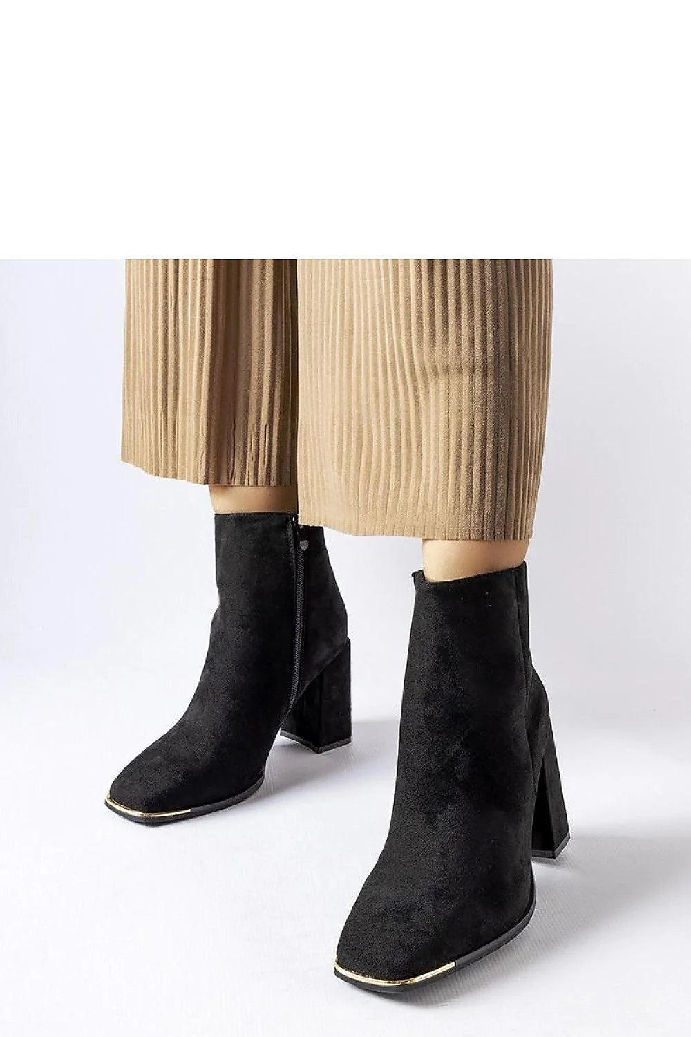 bottines suédine noires talons bloc hauts bouts carrés chevilles ajustées fermeture éclair latérale liseré doré stabilité confort sophistiquée élégante hiver