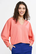 chemisier féminin moderne viscose rose saumon manches longues encolure V profonde coupe loose ample fluide taille haute ourlet asymétrique