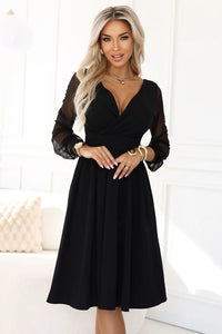 robe soirée Numoco noire midi femme cachecoeur plongeant encolure corsage taille marquée ceinture intégrée manches tulle transparentes crêpe fluide élégante