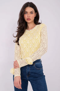 blouse dentelle florale jaune pâle ajustée col rond manches longues transparentes poignets volantés corps doublé viscose élasthanne