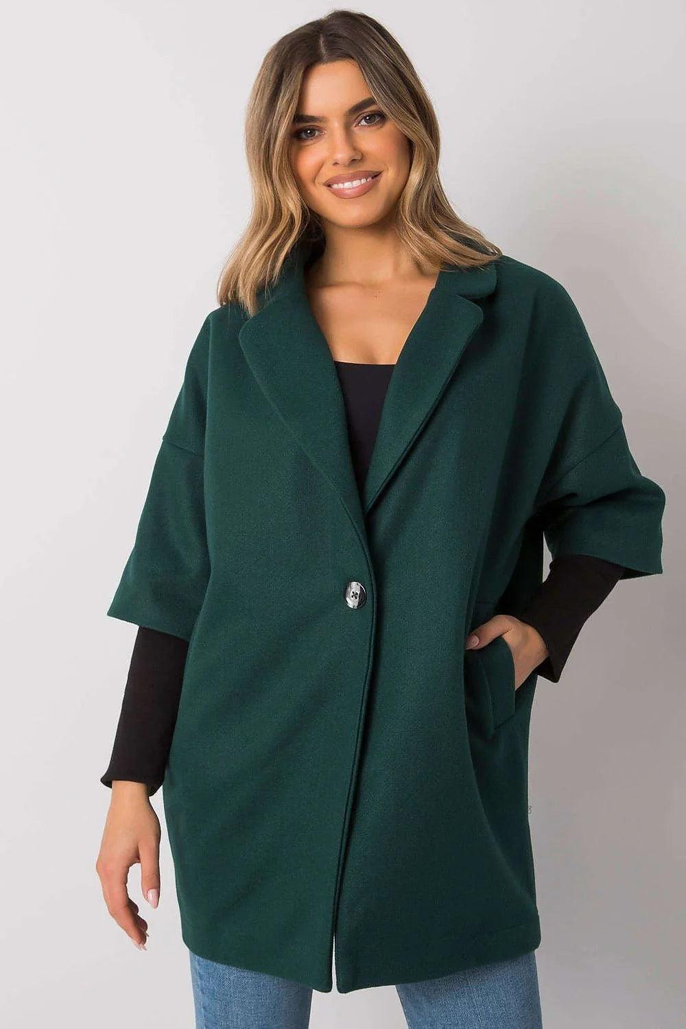 Manteau polyester noir oversize col droit manches longues poches latérales bouton métallique femme ample