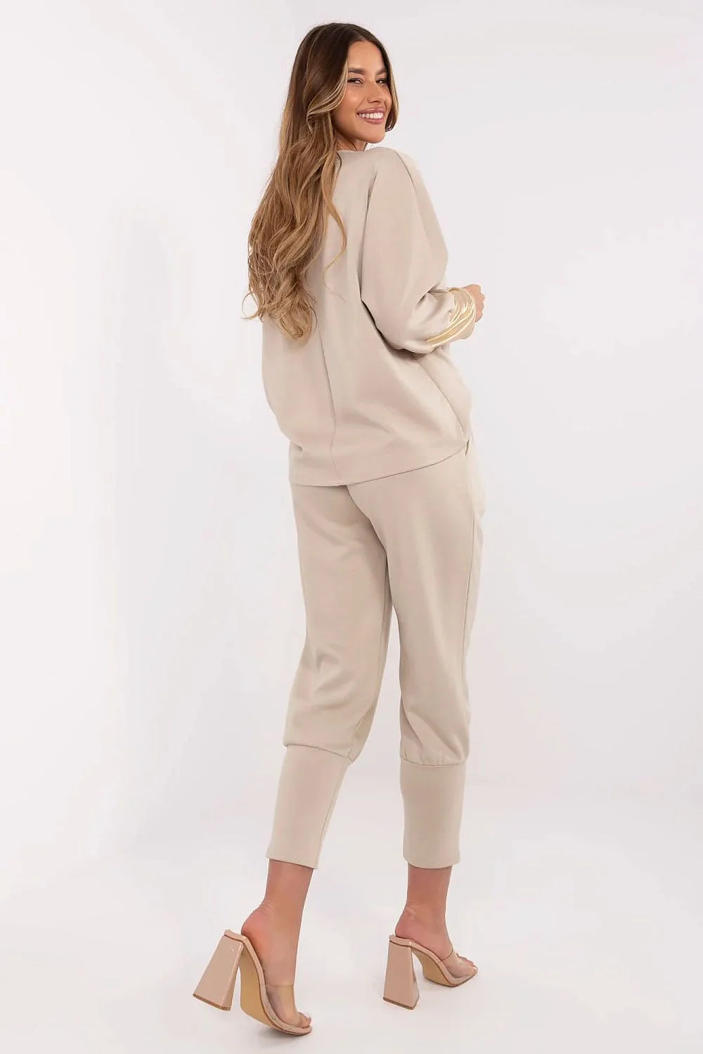 Ensemble mode féminin élégant coordonné haut manches longues pantalon taille haute doré beige clair femme