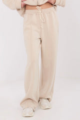 pantalon jogging large ample beige taille haute molletonné doux confortable ceinture élastique cordon serrage poches latérales coupe moderne