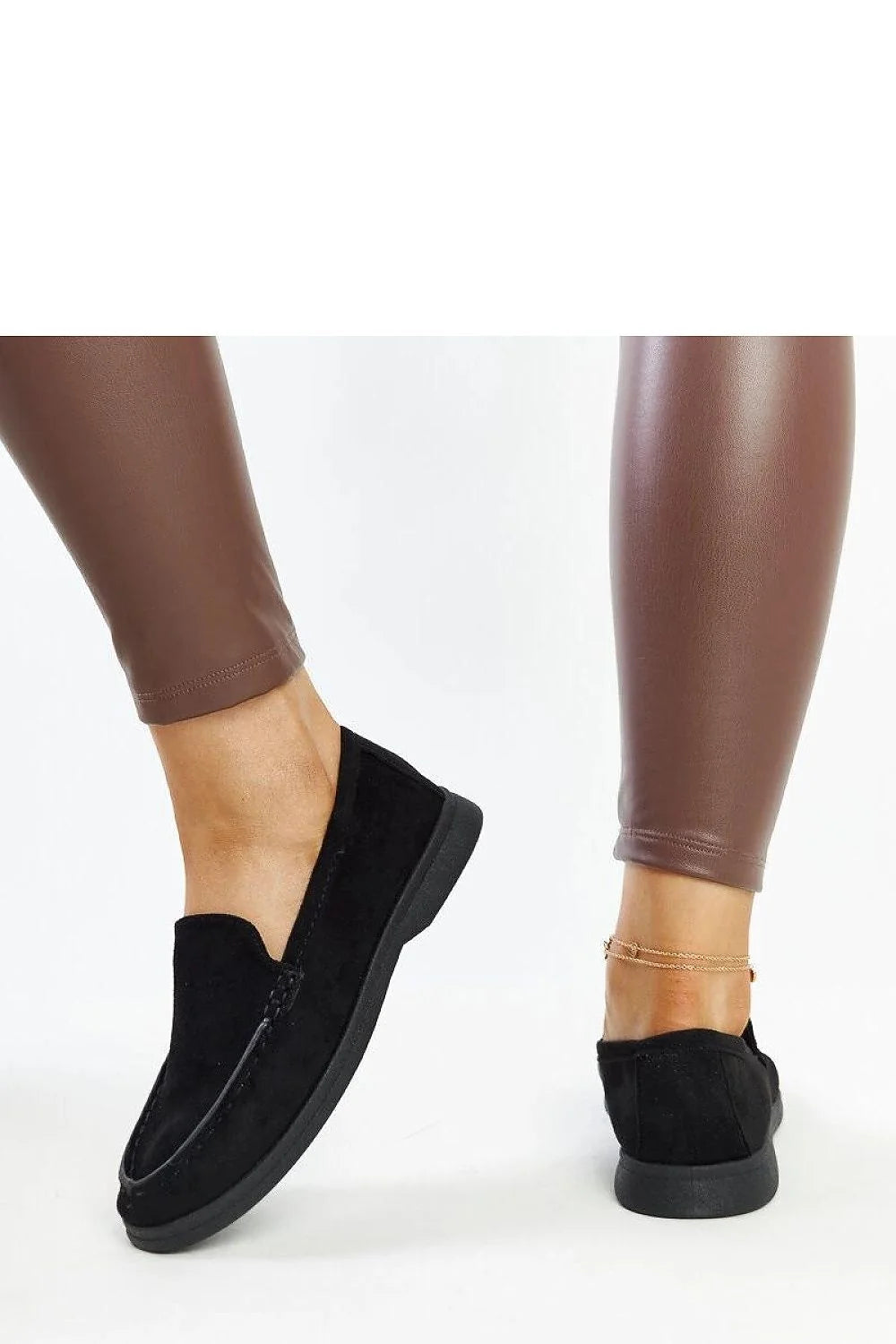 Moccasins élégants pour femmes en daim noir design intemporel confortable talon plat semelle caoutchouc
