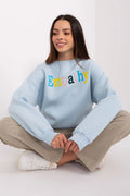 Sweatshirt femme couleur bleu clair design moderne Empathy brodé oversized manches longues coton polyester