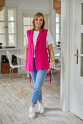 Gilet sans manches La Aurora coupe longue col tailleur finitions dorées matière doublée robe élégante femmes