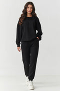 ensemble survêtement femme noir molleton épais oversize sweat col rond coupe ample brodé logo tonal poignets côtelés pantalon taille élastique
