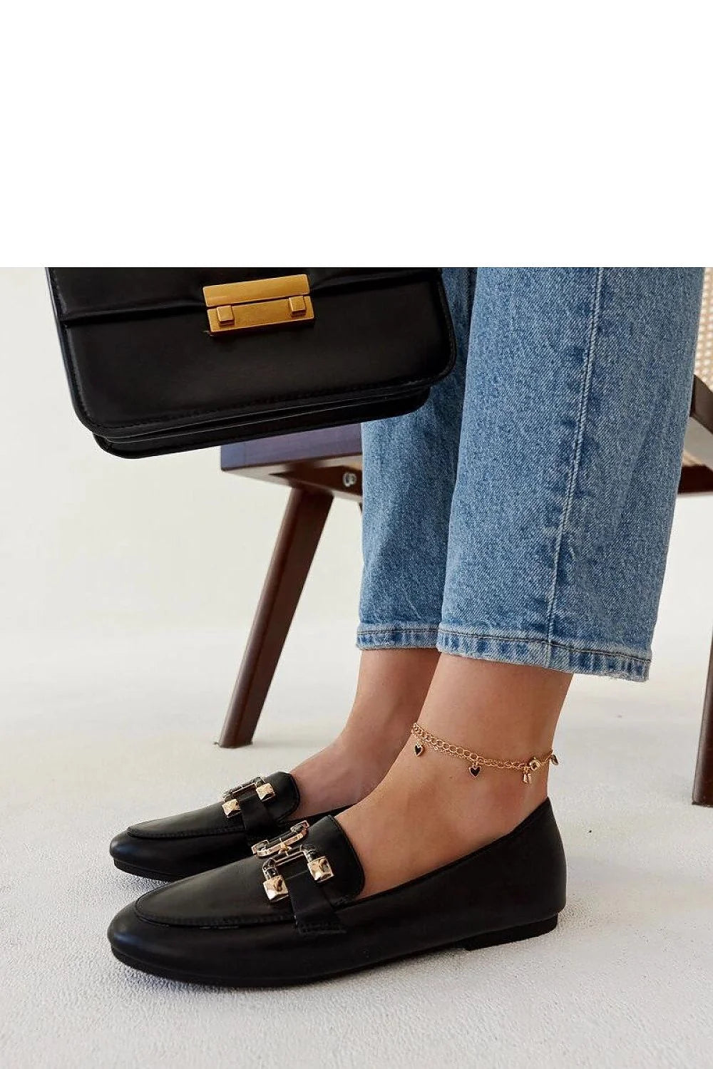 mocassins femme cuir noir détails dorés horsebit sanslacets talon plat semelle fine coutures apparentes confort légers élégants intemporels polyvalents sophistiqués