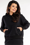 sweatshirt femme capuche oversize noir molleton coton elasthanne doux confortable coupe boxy épaules tombantes poches kangourou manches longues poignets côtelés