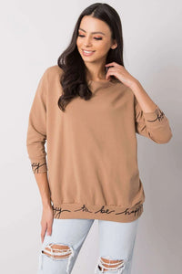 pull décontracté femme camel manches longues bouffantes coupe ample col rond molleton coton élasthanne inscription cursive noire finitions côtelées confortable