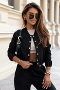 Veste bomber IVON élégante noire matériau luxueux fibres rayonne naturelle boutons pression dorés coupe ajustée style chic moderne femmes