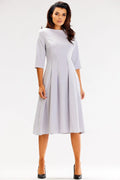 Robe de jour élégante coupe évasée manches 3/4 col bateau matière douce occasions multiples femme mode intemporel