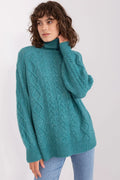 Pull femme col roulé texture tricotée motif torsadé couleur bleu canard manches longues coupe ample finitions côtelées