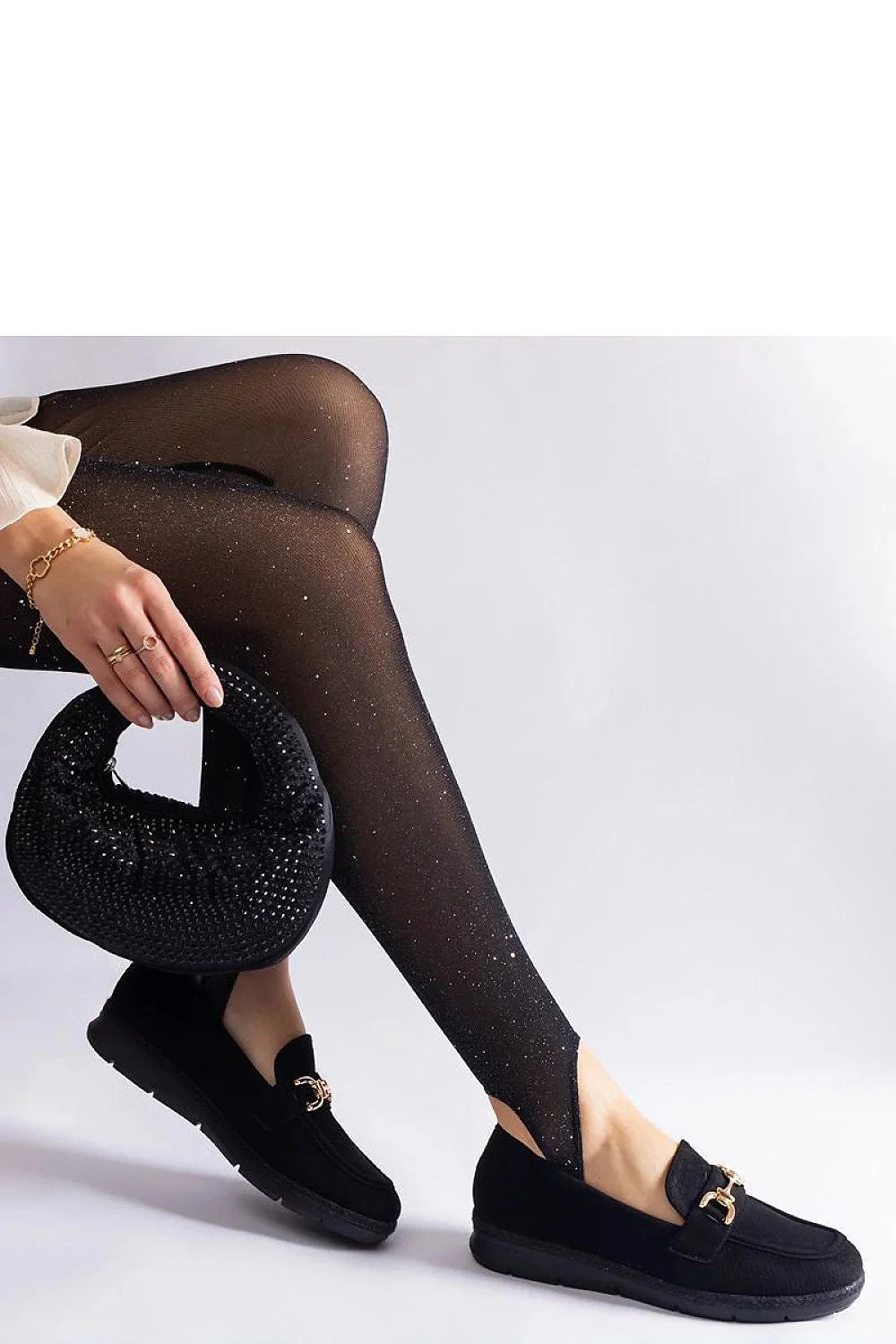 Ensemble mode féminine élégant collants mocassins sac à main accessoires noirs dorés paillettes perles