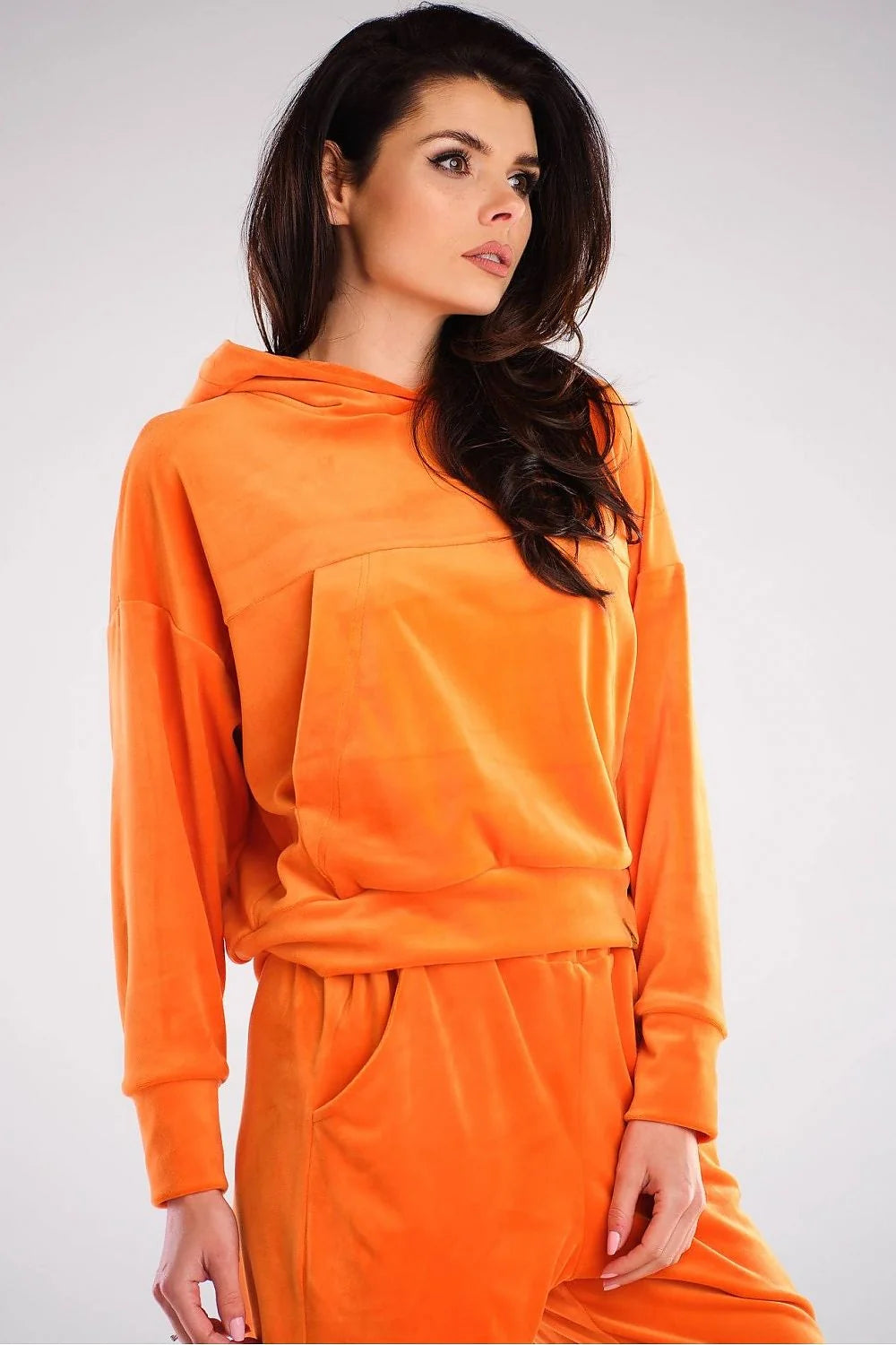 Sweatshirt femme velours rose vif style décontracté chic confortable coupe ample capuche poches pratiques