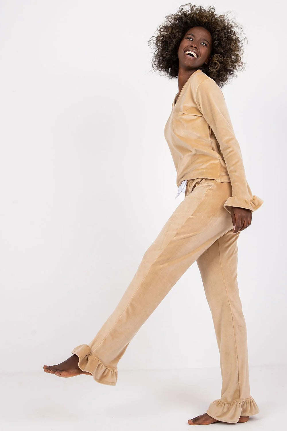Pyjama set for women in soft beige velour, elegant and comfortable, with ruffled sleeves and waist bow, perfect for lounging at home