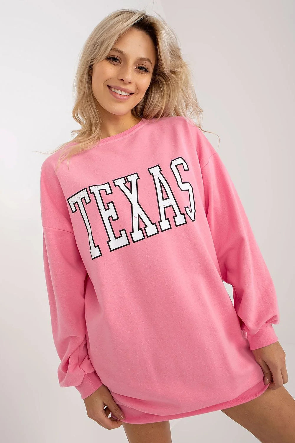 sweatshirt oversize rose bonbon coupe longue robe sweat col rond imprimé TEXAS blanc contour noir manches bouffantes poignets côtelés poches
