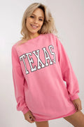 sweatshirt oversize rose bonbon coupe longue robe sweat col rond imprimé TEXAS blanc contour noir manches bouffantes poignets côtelés poches