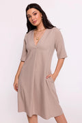 Robe de jour élégante en lin beige manches mi-longues encolure V poches latérales coupe évasée femme intemporelle