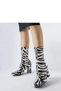 bottes Solea zébré imprimé noir blanc verni synthétique tige ajustée mi mollet talon bloc moyen fermeture éclair dorée rétro chic