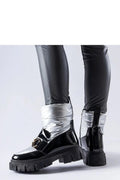 Bottes de neige Solea modernes audacieuses femmes cuir verni noir métallisé argenté boucle dorée semelle caoutchouc crantée fonctionnelles élégantes