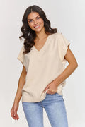 Gilet Makadamia sans manches en tricot beige clair coupe ample décolleté en V style moderne polyvalent femme