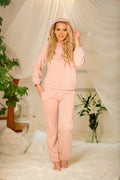Sweatshirt et pantalon assortis pour femme, rose pâle, style décontracté, ensemble détente intérieur, coton doux, coupe ample, capuche, poches latérales, confort maximum, tendance moderne, vêtements mode