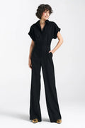 Combinaison femme moderne élégante manches courtes coupe fluide taille cintrée jambes larges couleur noire matériau léger finitions soignées