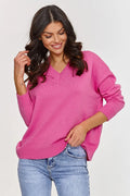 Pull femme casual couleur corail en viscose et PBT coupe ample manches longues encolure en V finitions côtelées