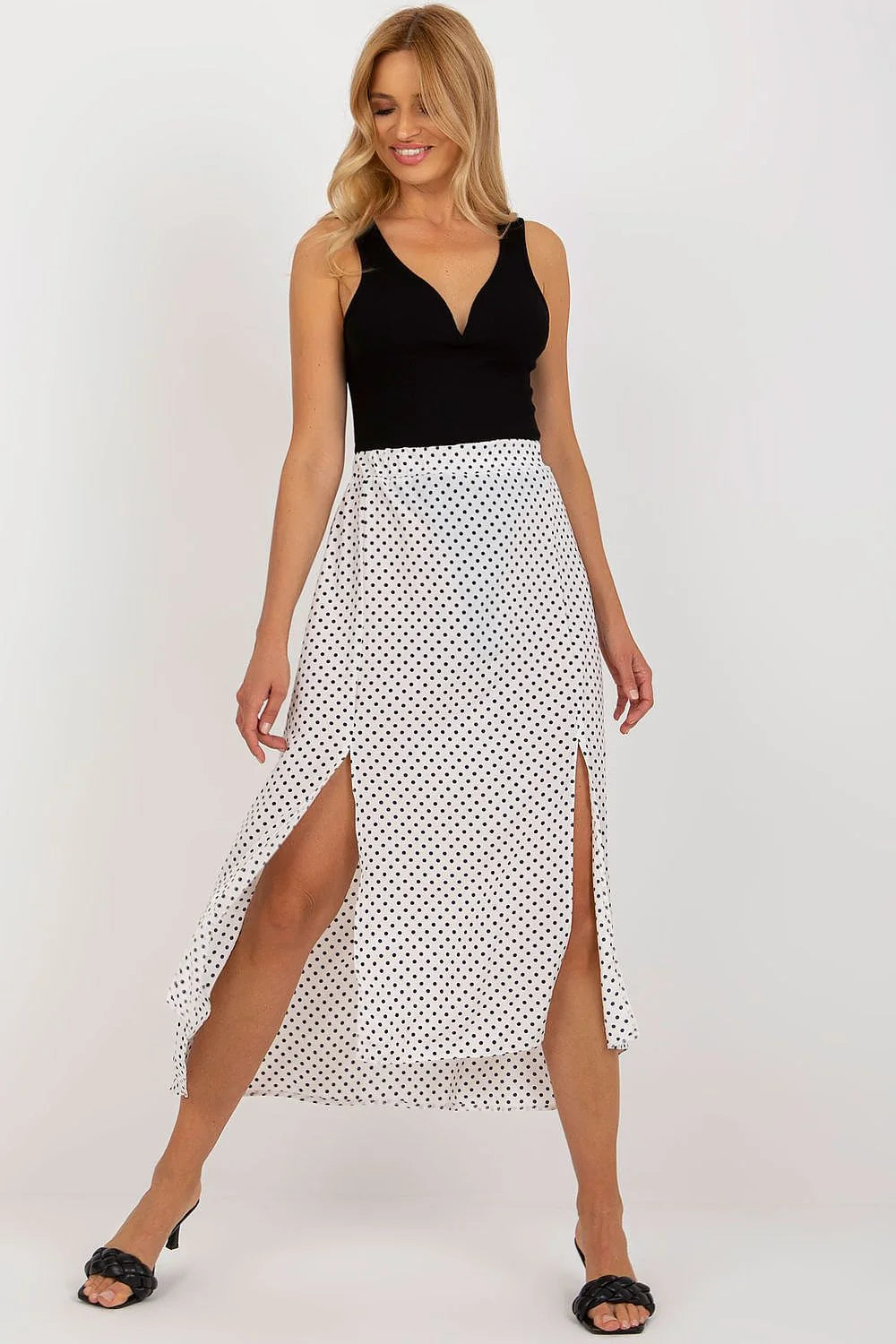 Robe élégante deux-en-un longue asymétrique noire et blanche pois noirs décolleté V sans manches jupe fendue taille ajustable femme