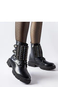 Bottes femme design audacieux moderne clous argentés cuir noir fermeture zip talon plat occasion urbaine tendance style punk-chic