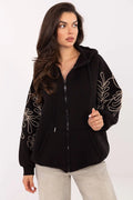 sweat capuche zippé femme oversize molleton noir poches kangourou manches bouffantes cordon serrage broderie florale beige contrastée bordscotes coton élasthanne