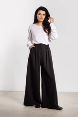 pantalon femme palazzo noir taille haute jambe extra large longueur pleine plis marqués devant poches latérales tissu fluide tombé structuré
