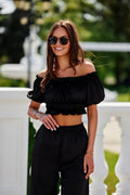 Ensemble coordonné chemisier et pantalon noire tissu léger off-shoulder manches courtes élastique高 waist large leg femme